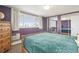 Well lit primary bedroom featuring large windows, carpet floors, and a spacious layout at 1029 E 8Th Ave # 901, Denver, CO 80218