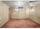 Finished basement with lighting and carpeted floors at 245 S 13Th Ave, Brighton, CO 80601