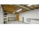 Unfinished basement area with painted walls, workbench, and storage shelving at 245 S 13Th Ave, Brighton, CO 80601
