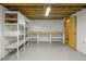 Spacious unfinished basement with workbench, shelving and storage at 245 S 13Th Ave, Brighton, CO 80601