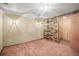 Finished basement with paneled walls and bright lighting at 245 S 13Th Ave, Brighton, CO 80601