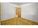 An empty room with an open wood door at 245 S 13Th Ave, Brighton, CO 80601