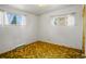 Inviting bedroom with neutral walls, two windows, and a carpeted floor at 245 S 13Th Ave, Brighton, CO 80601