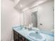 Bright bathroom with double sinks, mirrored vanity, and modern fixtures for a refreshing experience at 12289 W Atlantic Ave, Lakewood, CO 80228