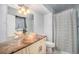 Bathroom featuring a marble vanity and a shower with a patterned shower curtain at 12289 W Atlantic Ave, Lakewood, CO 80228