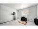 This bedroom features neutral carpet, and a large window for natural light at 12289 W Atlantic Ave, Lakewood, CO 80228