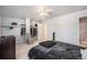 Bright bedroom boasts a closet with ample storage space and a door to the bathroom at 12289 W Atlantic Ave, Lakewood, CO 80228