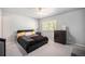 This spacious bedroom features a ceiling fan and a large window for natural light at 12289 W Atlantic Ave, Lakewood, CO 80228