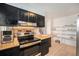 Clean kitchen featuring wood countertops, efficient appliances, and ample storage space for all your cooking needs at 12289 W Atlantic Ave, Lakewood, CO 80228
