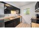 Functional kitchen featuring wood countertops, ample cabinet space, and stainless steel appliances for cooking at 12289 W Atlantic Ave, Lakewood, CO 80228