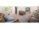 A living room with sofas, white chairs, neutral carpeting, and plenty of light at 12289 W Atlantic Ave, Lakewood, CO 80228