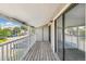 Outdoor balcony area providing community views from a wood deck with access to the home's interior at 18302 E Kepner Pl # 207, Aurora, CO 80017