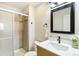 Modern bathroom features a glass shower, stylish vanity, and updated fixtures at 18302 E Kepner Pl # 207, Aurora, CO 80017