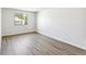 Bedroom with a large window providing ample natural light and neutral walls at 18302 E Kepner Pl # 207, Aurora, CO 80017