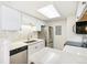 Bright kitchen with stainless steel appliances, white cabinets, and eye-catching backsplash at 18302 E Kepner Pl # 207, Aurora, CO 80017