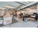 Unfinished basement space with exposed beams, offering potential for customization and storage at 13460 Broad Wing Ave, Parker, CO 80134