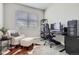 Inviting bedroom with a comfortable chair, a modern desk setup, and a relaxing workspace at 13460 Broad Wing Ave, Parker, CO 80134