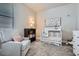 Cozy Bedroom with a comfortable armchair, crib, bookshelf, and charming decor for a peaceful environment at 13460 Broad Wing Ave, Parker, CO 80134