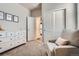 Versatile bedroom space with a dresser, reading chair and access to an additional room or closet at 13460 Broad Wing Ave, Parker, CO 80134