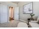 Versatile bedroom space featuring a comfortable chair and access to an additional room or closet at 13460 Broad Wing Ave, Parker, CO 80134