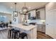 Elegant kitchen with quartz countertops, modern lighting, and stainless steel appliances at 13460 Broad Wing Ave, Parker, CO 80134
