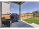 Relaxing covered patio with a grill, ideal for outdoor cooking and entertaining at 13460 Broad Wing Ave, Parker, CO 80134