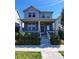 Two story home with gray siding and landscaping at 8668 E 54Th Pl, Denver, CO 80238