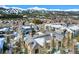 Picturesque aerial view of a community with snow-dusted roofs, surrounded by trees and the stunning mountain backdrop at 680 S Main St # 18, Breckenridge, CO 80424