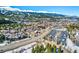 Expansive aerial view showcasing a vibrant community, with stunning mountain views and bustling streets in the distance at 680 S Main St # 18, Breckenridge, CO 80424