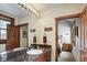 Bathroom featuring granite countertop, wood trim, and view to bedroom at 680 S Main St # 18, Breckenridge, CO 80424