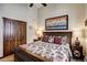 Bedroom features a comfortable bed, stylish furnishings, and rustic wood accents at 680 S Main St # 18, Breckenridge, CO 80424