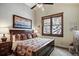 Comfortable bedroom with a large window offering natural light and views of the snowy outdoors at 680 S Main St # 18, Breckenridge, CO 80424