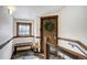 Inviting entryway with wooden door, tile flooring, and wooden stairway at 680 S Main St # 18, Breckenridge, CO 80424