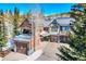 Inviting multi-story home with a three car garage, complemented by a well-maintained driveway and natural surroundings at 680 S Main St # 18, Breckenridge, CO 80424