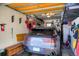 Organized garage featuring ample storage, including shelving and wall-mounted racks, providing efficient space optimization at 680 S Main St # 18, Breckenridge, CO 80424