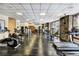 Well-equipped gym with modern cardio machines, strength training equipment, and a large window with views at 680 S Main St # 18, Breckenridge, CO 80424