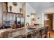Gourmet kitchen featuring granite counters, stainless steel appliances, and breakfast bar at 680 S Main St # 18, Breckenridge, CO 80424