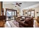 Open-concept living room with a sliding door that leads to a wintery outdoor patio at 680 S Main St # 18, Breckenridge, CO 80424