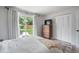 Sunlit bedroom with backyard views, and a spacious closet for ample storage at 5170 Deephaven Ct, Denver, CO 80239