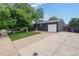 Charming home with a well-manicured lawn, driveway, and mature trees at 5170 Deephaven Ct, Denver, CO 80239