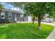 Charming single-story home featuring a well-manicured lawn, brick facade, attached garage and mature landscaping at 5170 Deephaven Ct, Denver, CO 80239