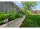 Well-maintained garden bed with leafy green vegetables and a wooden border at 5170 Deephaven Ct, Denver, CO 80239