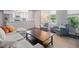 Inviting living space featuring open-concept design, stylish furniture, and a seamless flow into the adjacent kitchen at 5170 Deephaven Ct, Denver, CO 80239