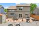 Large backyard with patio, seating, grill, and privacy fence at 10540 Tracewood Cir, Highlands Ranch, CO 80130