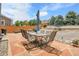 Charming backyard with stone patio, dining table and mature landscaping at 10540 Tracewood Cir, Highlands Ranch, CO 80130