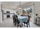 Bright dining area adjacent to the kitchen with sliding glass doors leading to the backyard at 10540 Tracewood Cir, Highlands Ranch, CO 80130