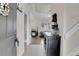 Bright entryway with view of fireplace, tiled floors and coat hooks at 10540 Tracewood Cir, Highlands Ranch, CO 80130