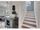 Welcoming entryway with staircase, decorative console table, and stylish décor at 10540 Tracewood Cir, Highlands Ranch, CO 80130