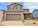 Charming two-story home features a brick-accented garage and inviting front porch at 10540 Tracewood Cir, Highlands Ranch, CO 80130