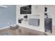 Living room featuring a built-in media center and hardwood floors at 10540 Tracewood Cir, Highlands Ranch, CO 80130